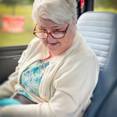 PHOTO OF A CLIENT ON OUR BUS